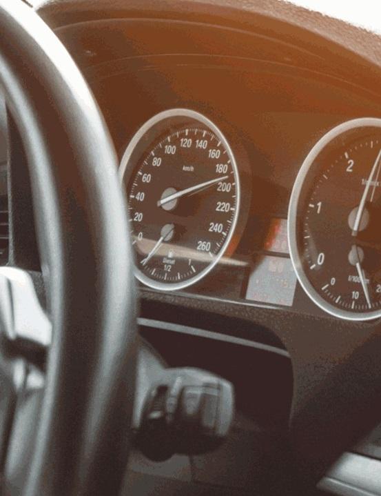 German market guide A close up view of the speedometer of a car with on the left side a part of the steering wheel