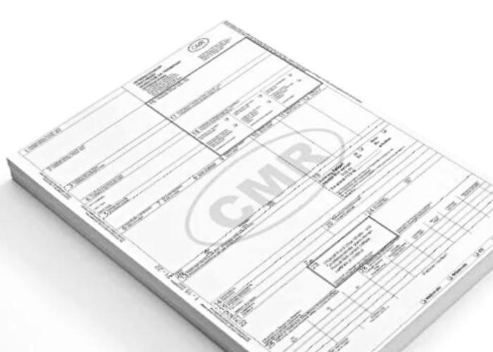 a photo of a blog of white paper with the CMR document at the top