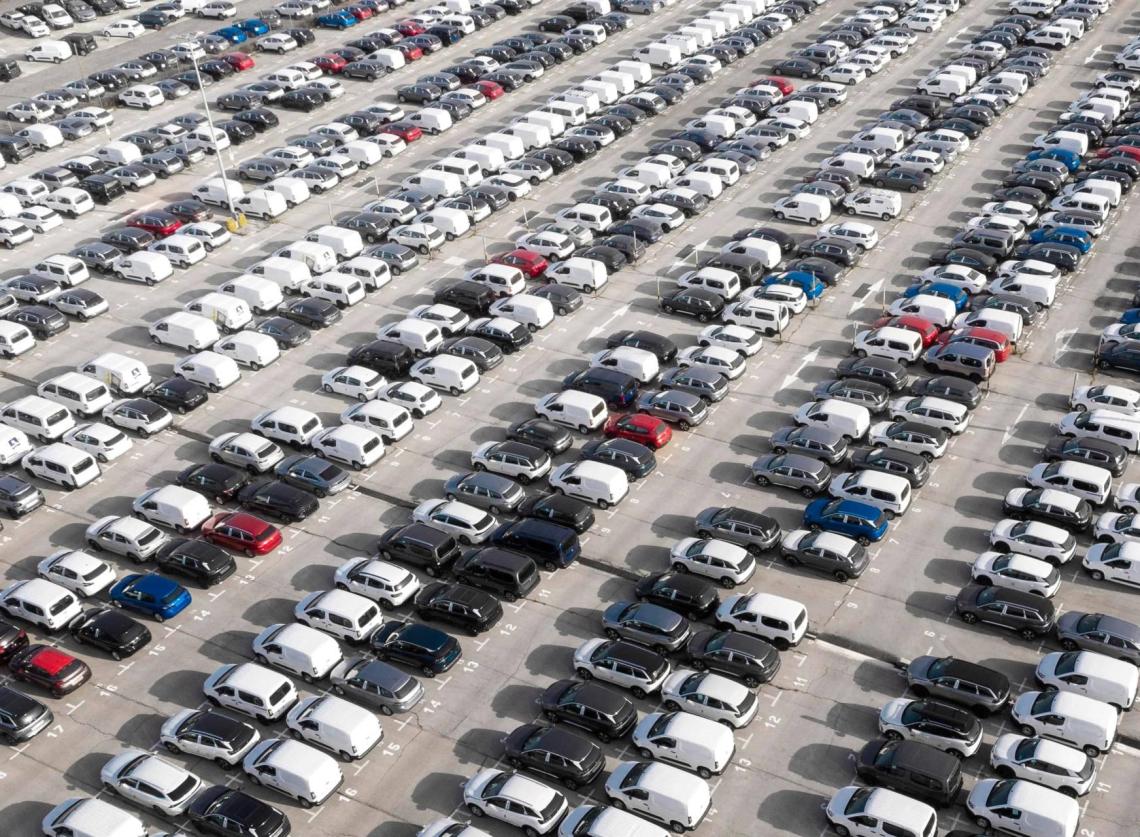 Storage park birds eye view A view from the sky of many vehicles parked in a storage park