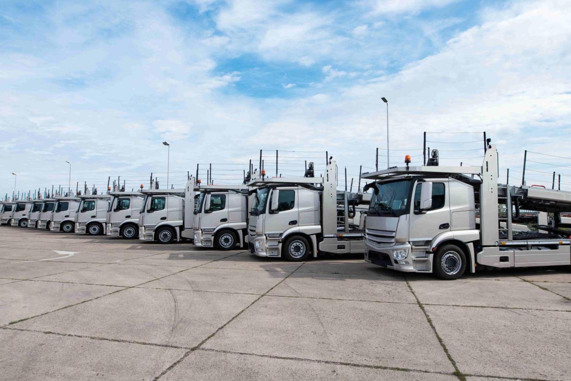 Parked trucks vehicle transport A line of parked transport trucks used to carry multiple vehicle