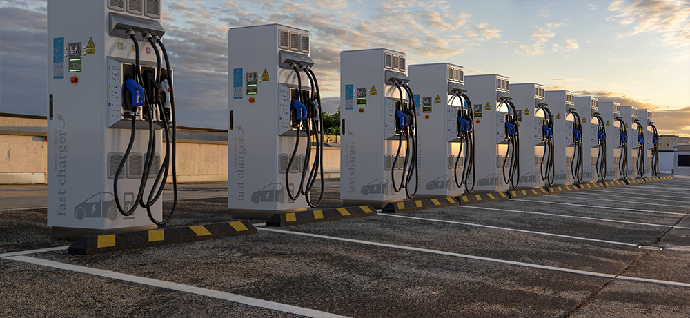 Charging station in the sunset A bunch of charging stations aligned with the sunset in the background